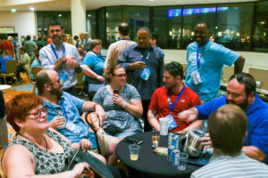 Attendees laughing around a table